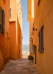 Corsica, Bastia view of Porto Vecchio old town on sunny day, Corsica, France. Old town narrow street with colorful ochre facades.