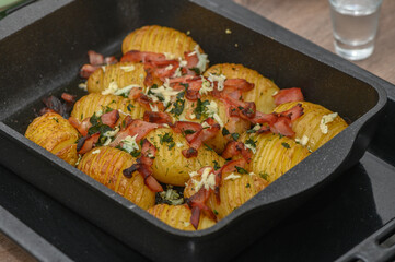 baked potatoes with bacon in the kitchen 2