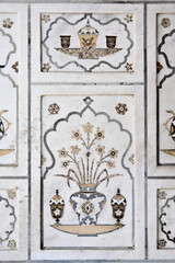 AGRA, UTTA PRADESH / INDIA - FEBRUARY 27, 2012 : INLAID WORK OF COLOR MARBLE STONE ON WALL OF ITMAD UD DAULA (BABY TAJ).