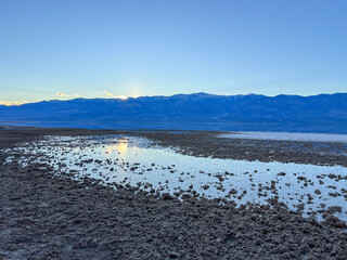 Scenic view of Lake Manly (Badwater Basin) in Death Valley at sunset.
