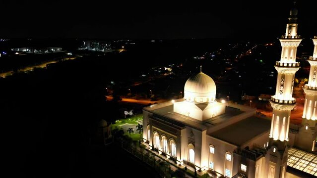 Nighttime aerial photograph moving to the right of Masjid Sri Sendayan, mosque