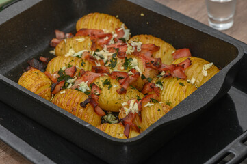 baked potatoes with bacon in the kitchen 4