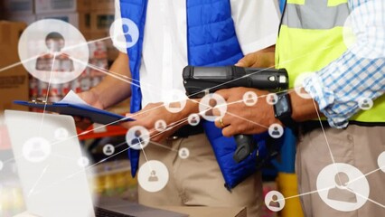 Animation of network of people icons over diverse male workers using laptop and scanner in warehouse - Powered by Adobe