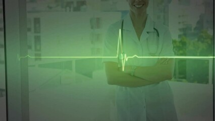 Animation of green heartbeat monitor over smiling caucasian female doctor at hospital