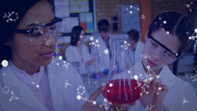Animation of element structures over diverse schoolgirls carrying out experiment in chemistry class