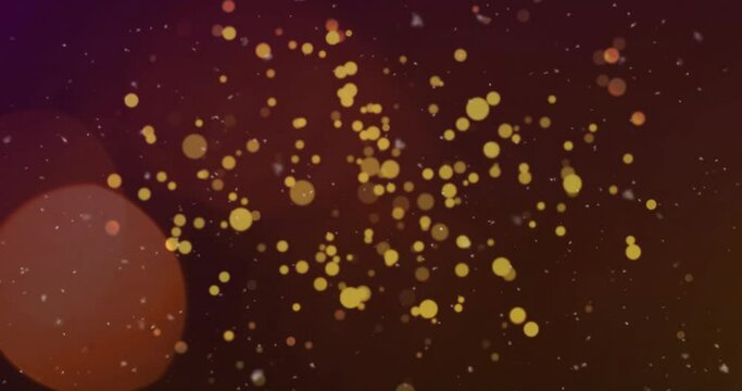 Animation of glowing gold light spots rising on dark background