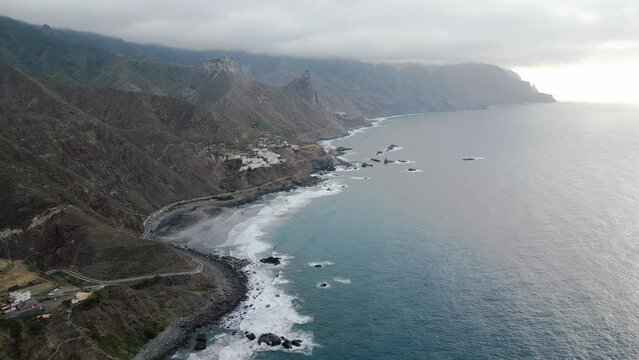 Wild natural beach surrounded by mountains in the north shore of Tenerife. Aerial view