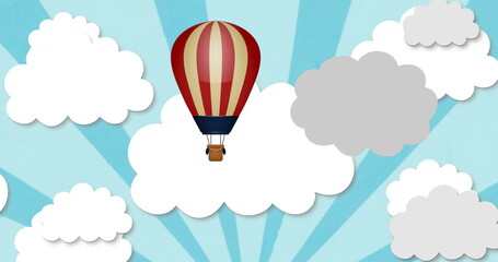 Fototapeta premium Image of clouds and hot air balloon over grey background