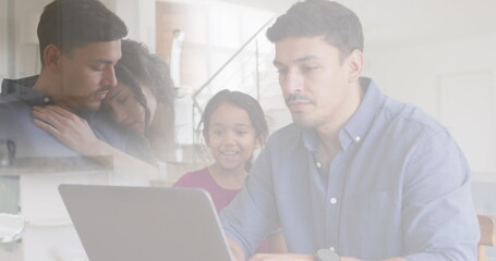 Composite of sad parents embracing, and happy father and daughter looking at laptop together