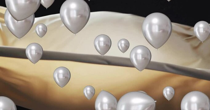 Animation of silver balloons floating over gold and black background