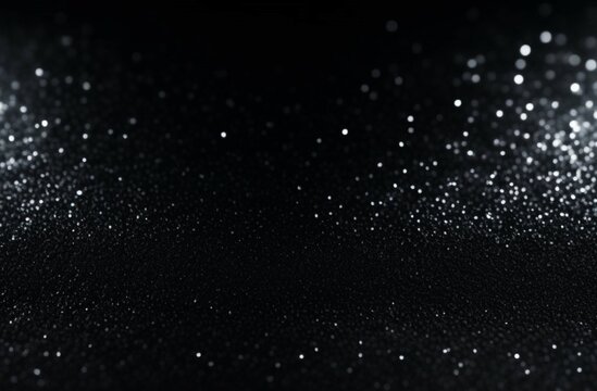 Abstract bokeh silver light glitter on black background. Silver glitter lights on black background. Glitter defocused. Blurred sparkle magic background. Wallpaper, designer background, card