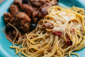 Italian chicken Cacciatore hunter's stew with spaghetti noodles