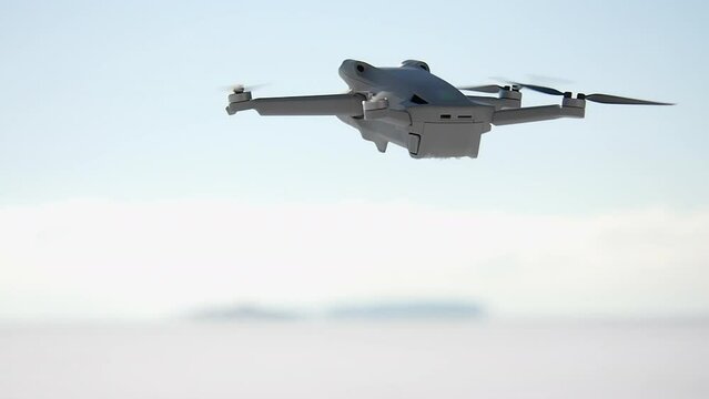 Small consumer drone hovers in mid-air, four propellers spinning