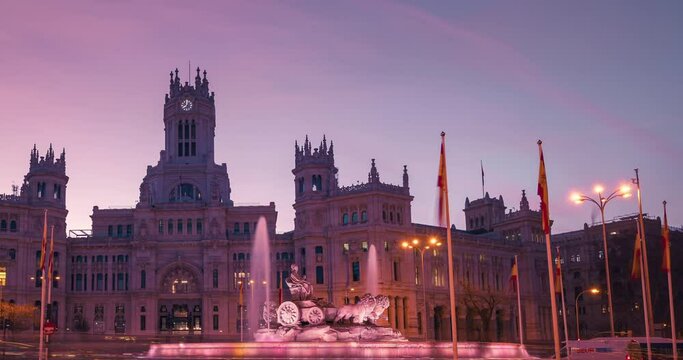 Close up establishing shot Sunrise timelapse Madrid City Town Hall Casa de Correos and Cibeles square and fountain night to day time lapse