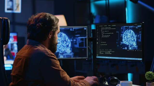 Developer updating artificial intelligence neural networks, typing on computer keyboard in neon lit personal office. Freelancing IT specialist writing AI code, training machine learning, camera A