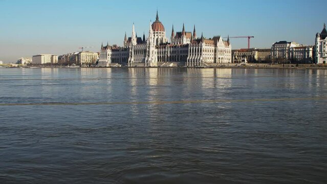 Budapest city (Hungary capital) center view with Parliament building and Danube river on a sunny day, gothic architecture, wide low angle panoramic shot