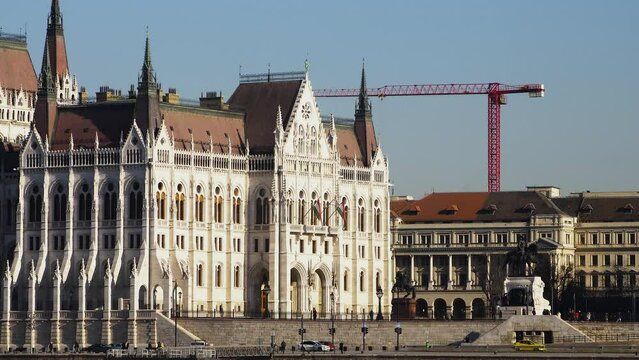 Budapest city (Hungary capital) center view with Parliament building and Danube river on a sunny day, gothic architecture, medium distant shot