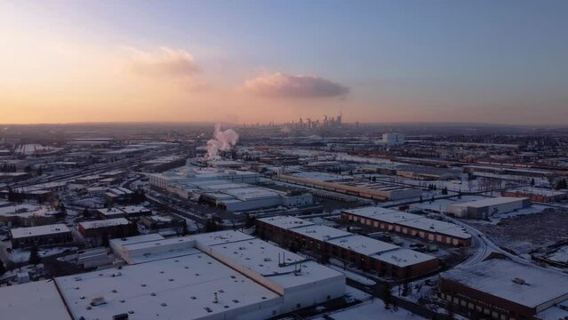 Industrial winter view with downtown skyscrapers in the background