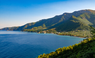 Obraz premium Scenic view from hilltop: mountains and blue waters in Thassos, Greece