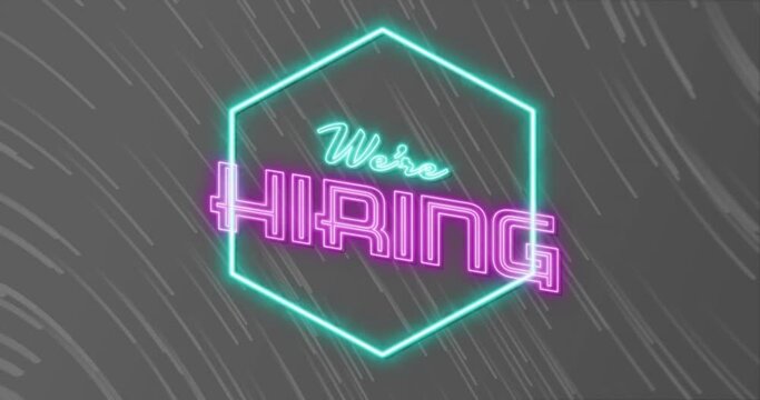 Animation of we're hiring neon text over neon pattern on grey background