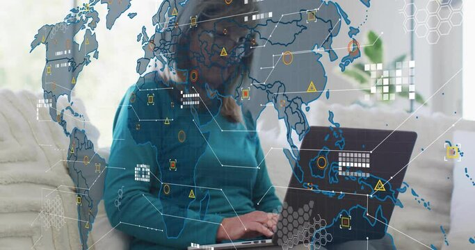 Animation of world map and data processing over caucasian woman using laptop