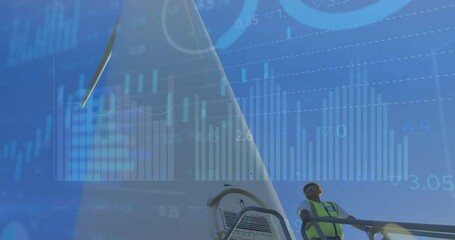 Animation of financial data processing over male engineer by wind turbine - Powered by Adobe