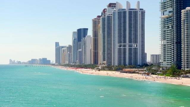Aerial video pulling away from the shore Miami Sunny Isles 4k 2024