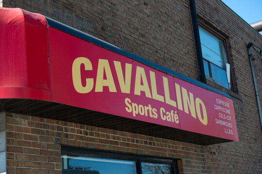exterior building and sign of Cavallino Cafe Sports Bar, a cafe, located at 930 The Queensway in Etobicoke, Toronto (Canada)