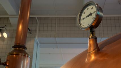 Pressure gauge mounted on boiler at beer factory - obrazy, fototapety, plakaty