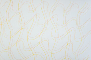 overlapping yellow and orange wavy color pencil marks (with patterned lines) on tracing paper