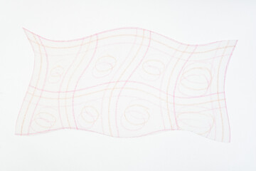 wavy paper cutout shape with curving color pencil marks (with patterned lines) on tracing paper
