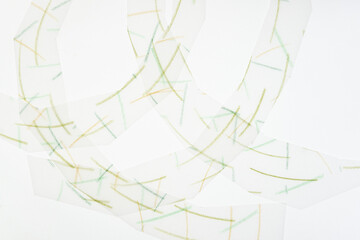 short green color pencil marks (with patterned lines) on tracing paper