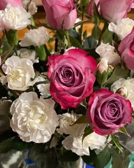 bouquet of pink roses and white carnations 