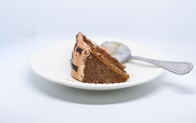 small piece of chocolate cake, delicious taste, brown color on a white background