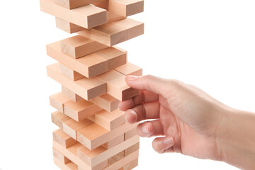 Woman playing Jenga on white background, closeup