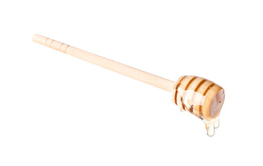 Natural honey dripping from dipper on white background