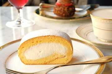 piece of swiss roll cake on a plate