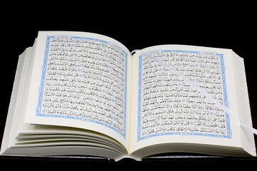 The Holy Quran open pages written in Arabic languag