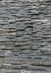 Natural stone texture on the wall. Selective focus.
