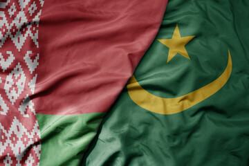 Fototapeta premium big waving national colorful flag of mauritania and national flag of belarus.