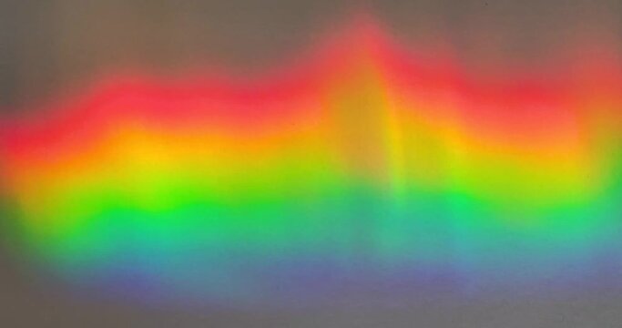 Wavy rainbow prism creates colorful video background element