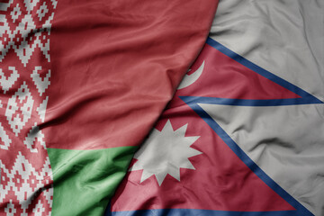 big waving national colorful flag of nepal and national flag of belarus.