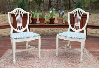 Porch with chairs and colorful flowers