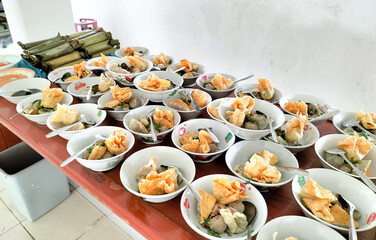 Amazing and nice food on the table. Bakso Malang lined up in a bowl in a traditional event, traditional Indonesian food. Indonesia.