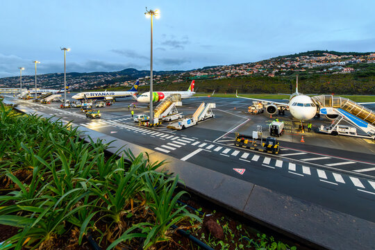 Evening view from a passenger viewing platform of the runway at the Madeira Cristiano Ronaldo Airport, or Funchal Airport, in Funchal, Portugal, on the Canary Island of Madeira on January 7 2024.	