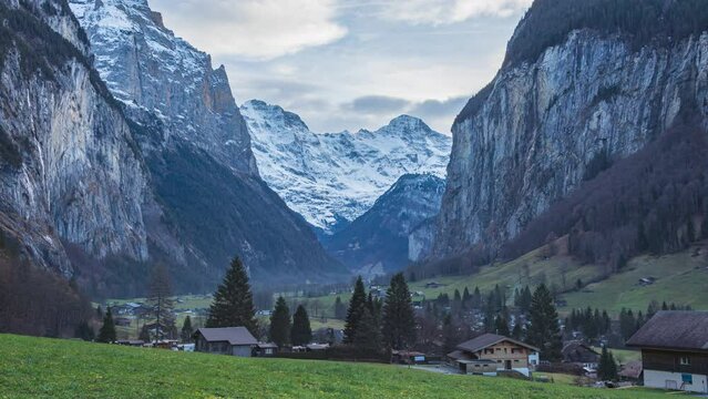 Time lapse view on Lauterbrunnen Valley with clouds moving over mountains. Lauterbrunnen Valley, Berner Oberland, Switzerland.