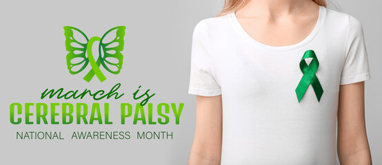 Woman in white t-shirt with green ribbon on grey background. Liver cancer concept - obrazy, fototapety, plakaty