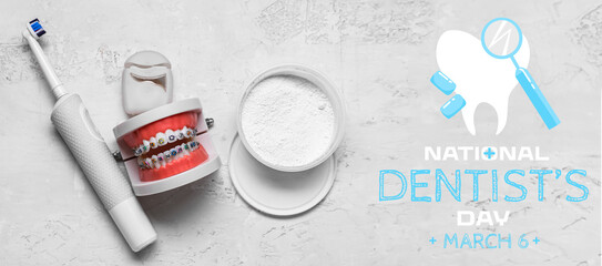Model of jaw with braces, toothbrush, powder and dental floss on light background