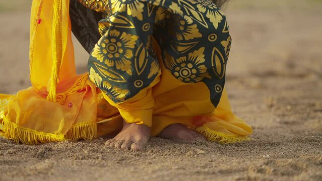 Close-up feet of balinese dancer in traditional wear, authentic cultural performance, bali