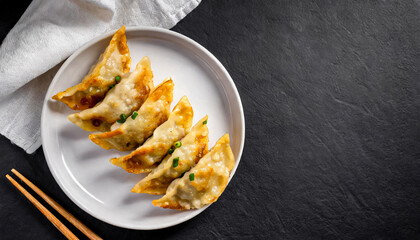 gyoza or dumplings snack with soy sauce. top view of fried Gyoza with soy sauce, aisan cuisine, korean food, japanese food, copy space